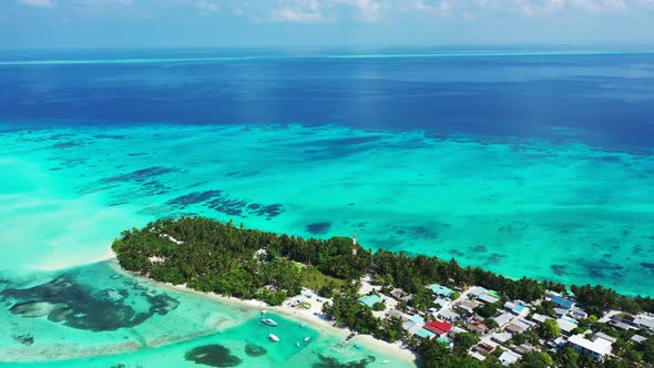 Natural flying tourism shot of a paradise sunny white sand beach and aqua blue ocean background in c alt