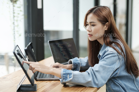 Young programmer or IT specialist satisfied with her work done. - Stock Photo - Images