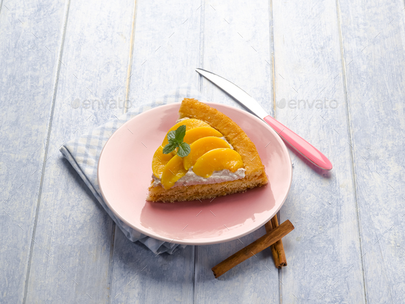 cake with peach and whipped cream