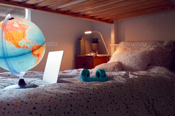 Inside Child's Bedroom At Night With Laptop Headphones And Globe On Bunk Bed - Stock Photo - Images