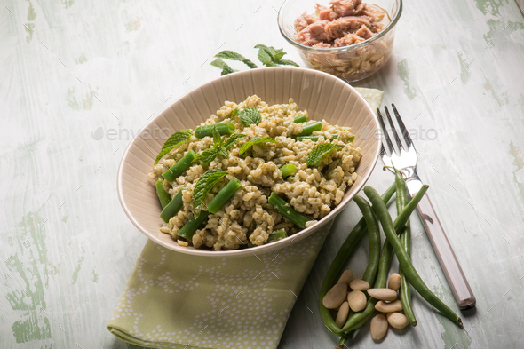 cold rice salad with tuna greenbeans almond and mint - Stock Photo - Images