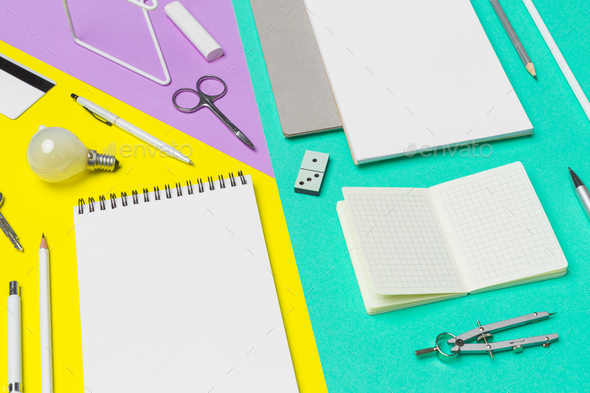 school supplies at colorful paper background - Stock Photo - Images