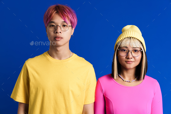Asian teenagers in eyeglasses posing and looking at camera - Stock Photo - Images
