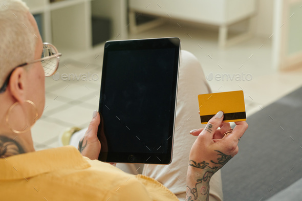 Woman doing online shopping on tablet pc