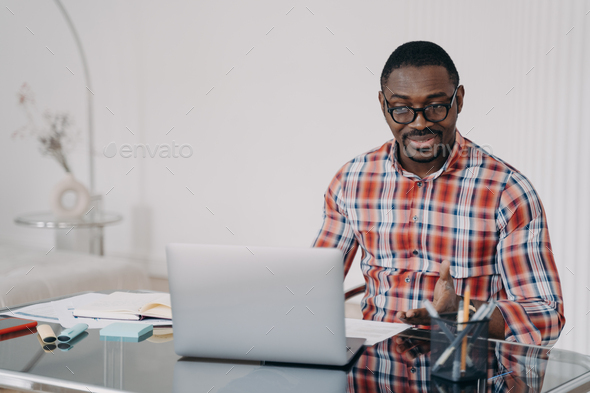 Puzzled african american man look at laptop screen. Poor internet ...