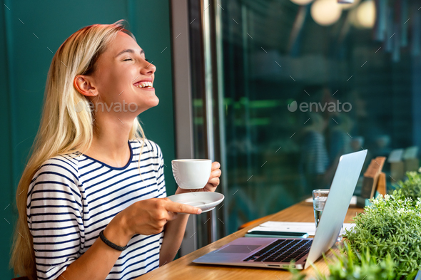 Portrait of young excited woman making a video chat on digital device. People education work concept - Stock Photo - Images