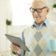Advanced aging man using tablet to communicate with doctor - PhotoDune Item for Sale