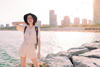 young traveler girl smiling happy near the sea