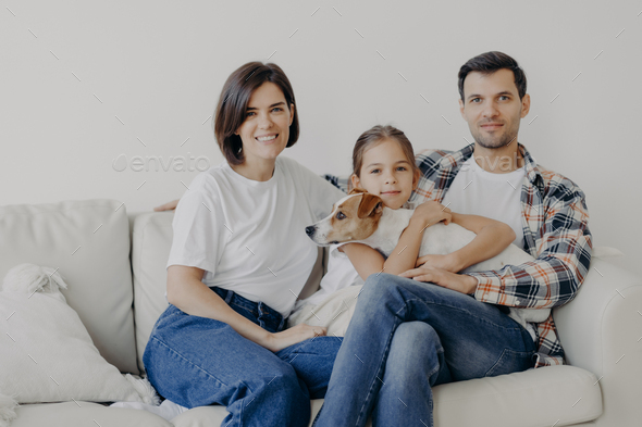 Father, mother, their little daughter and pedigree dog spend weekend at ...