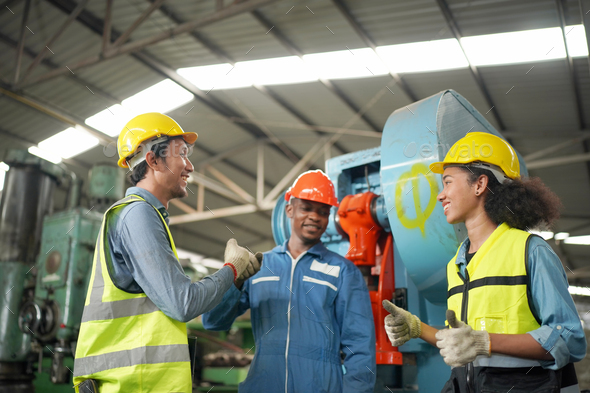 Three Diverse Multicultural Heavy Industry Engineers and Workers in Uniform at Steel Factory. - Stock Photo - Images
