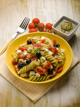 pasta salad with pesto feta tomatoes and black olives