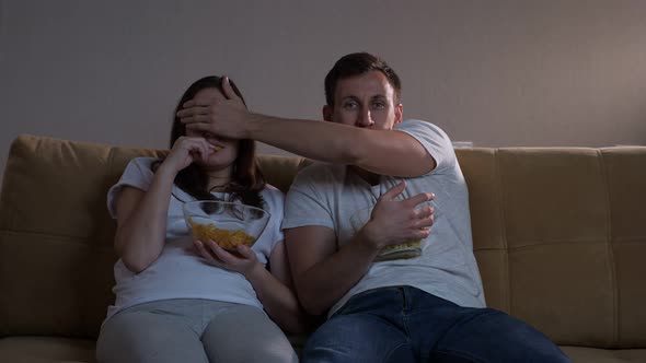 Man Closes Lady Eyes Not to Watch Terrible Moment in Film alt