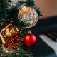branches of a decorated Christmas tree on the background of piano keys. - PhotoDune Item for Sale