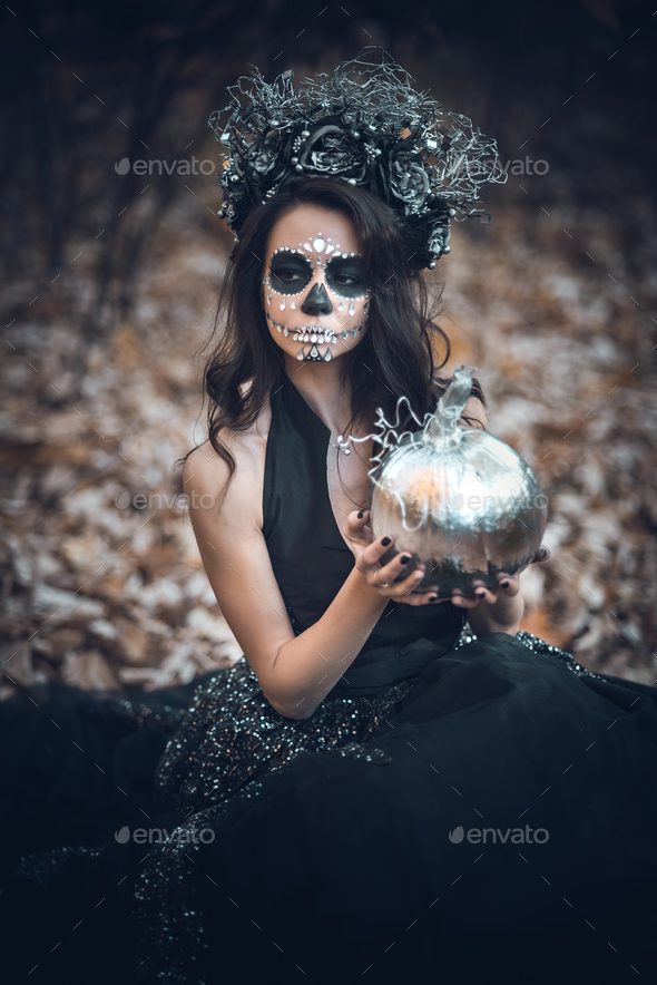 Closeup portrait of Calavera Catrina in black dress. Sugar skull makeup ...