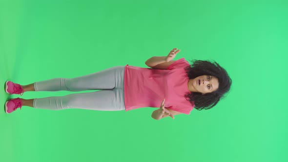 Portrait of Young Female African American Looks Frightened at the Camera and Says Oh My God alt