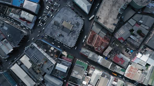 Overhead drone shot of road with cars and roofs with solar panels in Bridgetown, Barbados alt