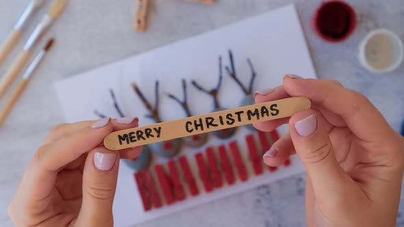 Making Diy Merry Christmas Deer on Greeting Card Postcard Made of Pebbles Sea Stones Clothespins and alt