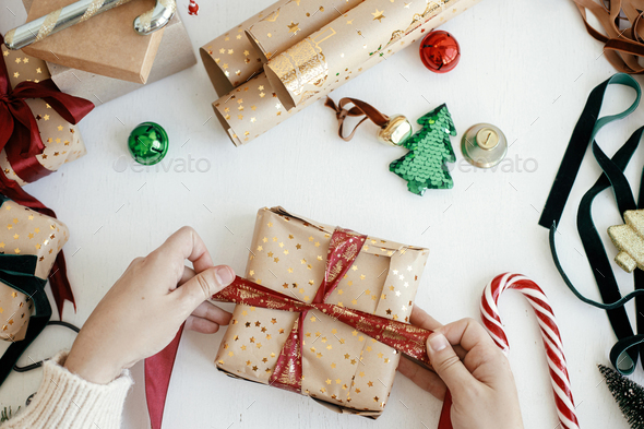 Christmas Background With Gift Boxes And Rolls Of Kraft Wrapping