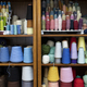 Shelves covered in spools of colorful yarn waiting for crocheting or knitting. - PhotoDune Item for Sale