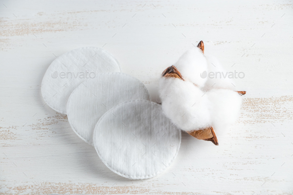 Cotton cosmetic pads on white background. Facial care concept.