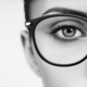 Female eye with long eyelashes in eyeglasses - PhotoDune Item for Sale