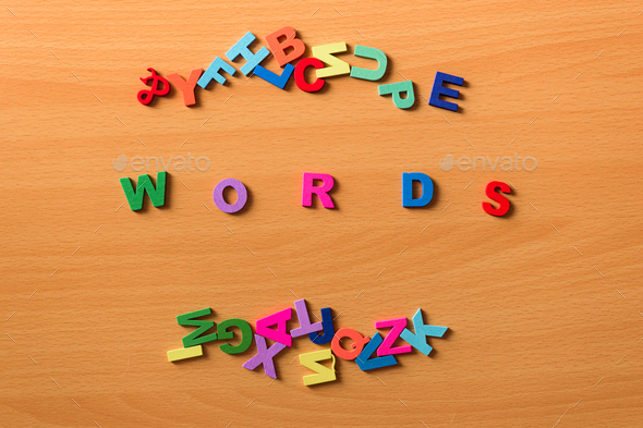 The word Words in colored letters on a wooden background - Stock Photo - Images