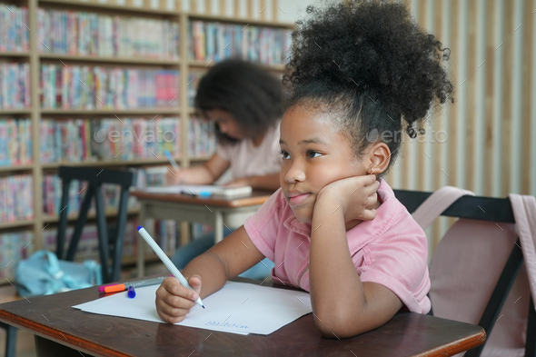 African kids drawing and do homework in classroom, young girl happy ...