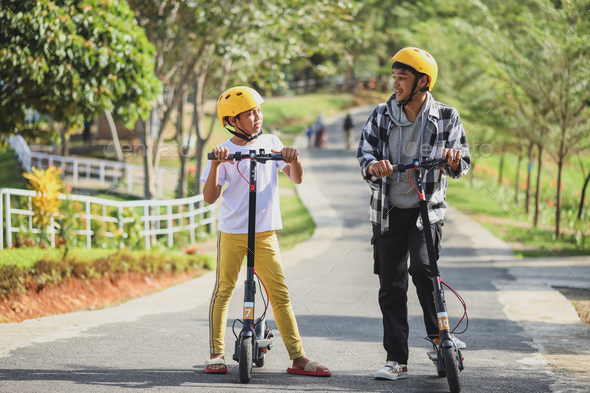 Two Electric scooter riders talking
