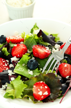 Concept of tasty salad, salad with strawberry, close up