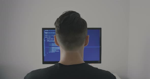 Experienced IT Programmer Works on a New Program