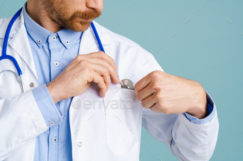 White male doctor wearing lab coat posing with stethoscope