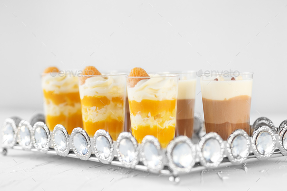 Set of delicious cream desserts. The concept of food, desserts and pastries, catering