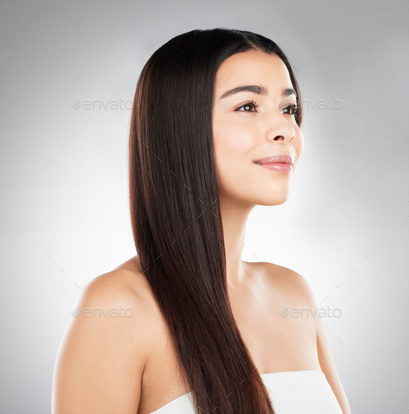 Premium Photo  Soft hair is a journey. studio shot of a beautiful young  woman showing off her long silky hair against a grey background.