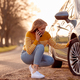 Woman Calling For Help On Phone After Car Breakdown On Country Road With Tyre Puncture - PhotoDune Item for Sale