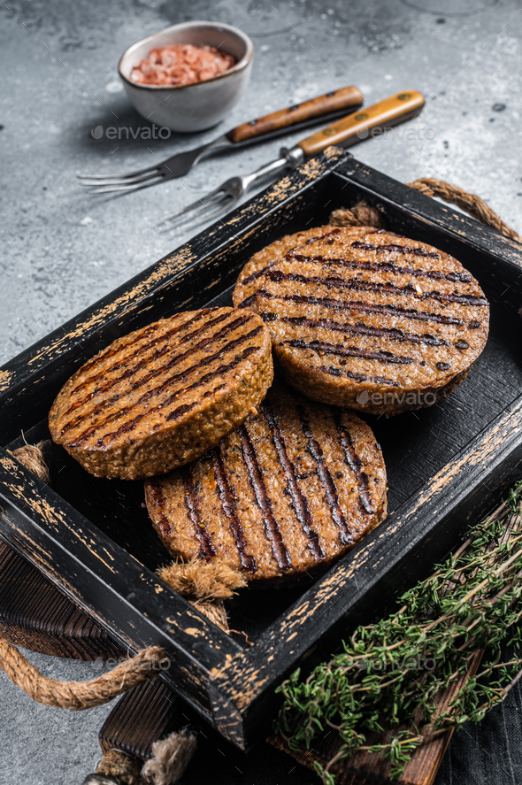 Roasted meat free patties, plant based meat burger cutlets in wooden