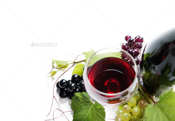 Top view of glass of red wine and bottle with grape vine - Stock Photo - Images