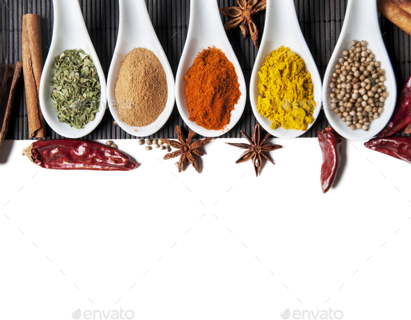 op view on mixed dry colorful spices in spoons isolated on white background.  - Stock Photo - Images