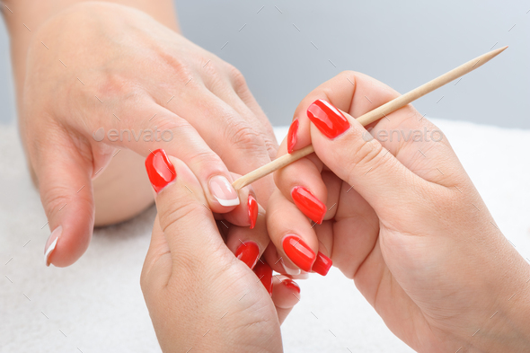Cuticles care with cuticle pusher