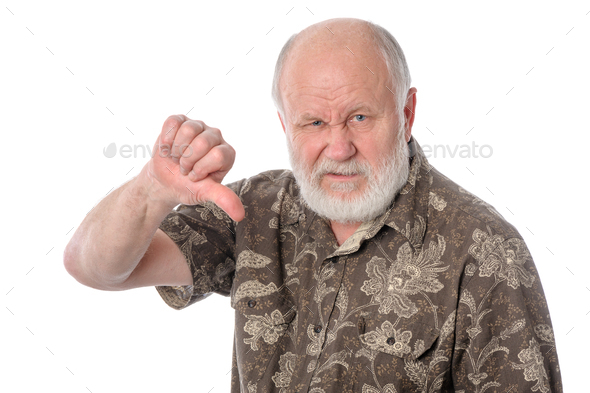 Senior man shows thumbs down gesture, isolated on white