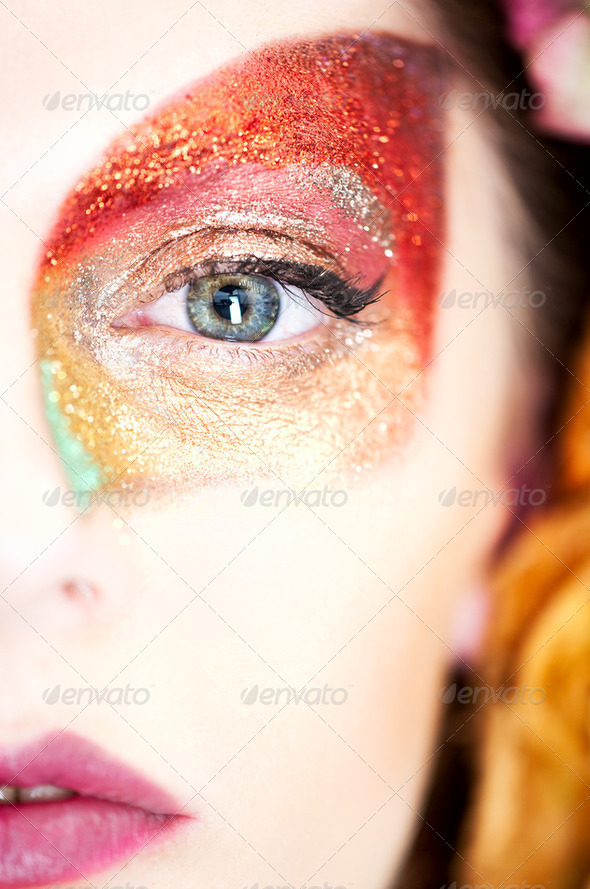 beauty makeup portrait of half a face of a young woman, with an - Stock Photo - Images