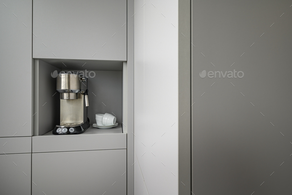 Modern gray kitchen corner with espresso coffee machine