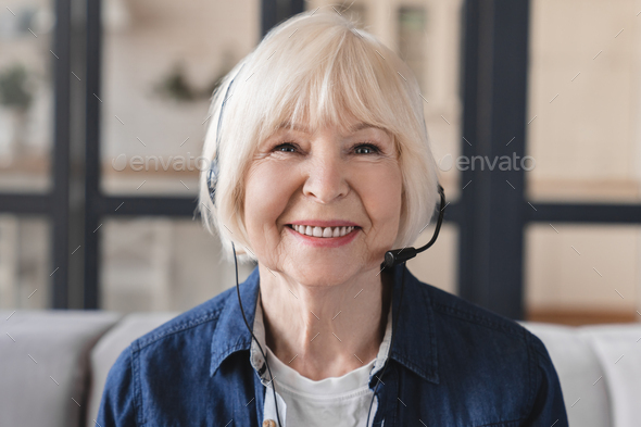 Front view image of a video call of elderly old senior businesswoman IT support hot line worker