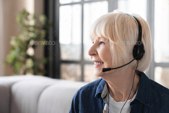 Elderly old senior businesswoman IT support hot line tele worker on zoom having video call