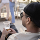 Close up of latino man in cap sitting at the party outdoors - PhotoDune Item for Sale