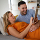 Portrait of happy couple with tablet,watching something online. People digital device concept - PhotoDune Item for Sale