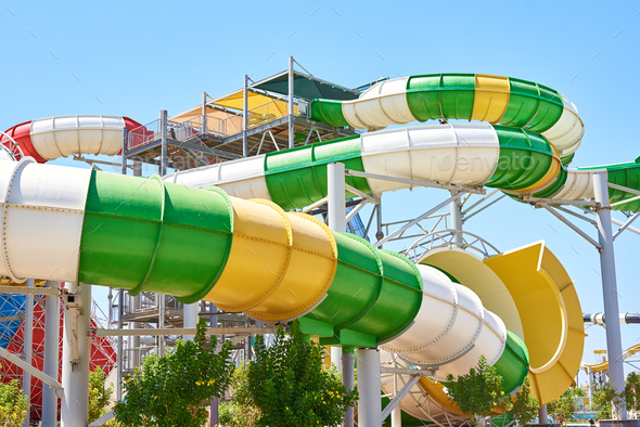 Close up of a tube water slide in aqua park against blue sky