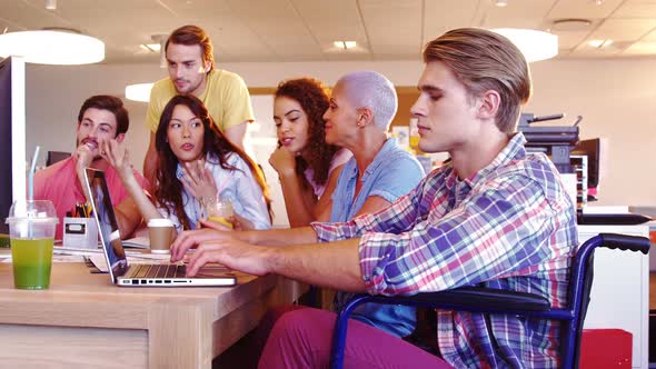 Colleagues having discussion on personal computer alt