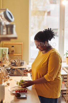 Black Woman Cooking in Sunlight