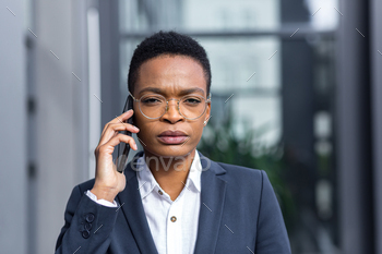 African american business woman, boss talking serious on the phone, close-up photo portrait