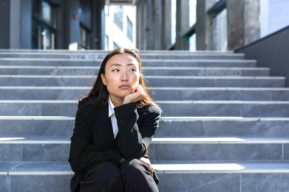 Sad asian woman fired from work sitting on the stairs Stock Photo by ...